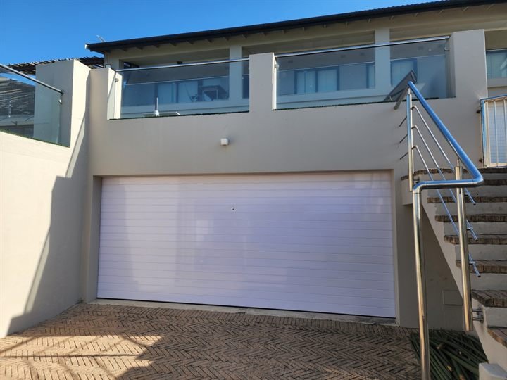 White sectional garage door on a residential double garage